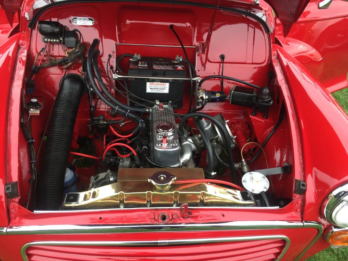 Morris Minor in red showing engine