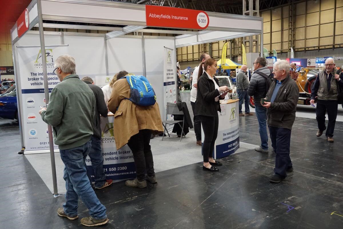 Image of Abbeyfields stand with clients visiting